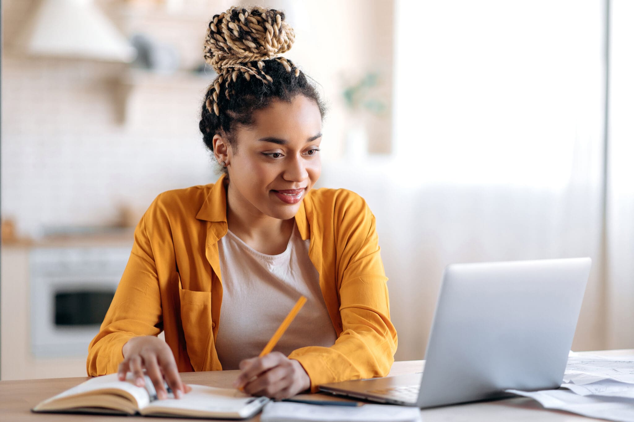 Student studying at a laptop